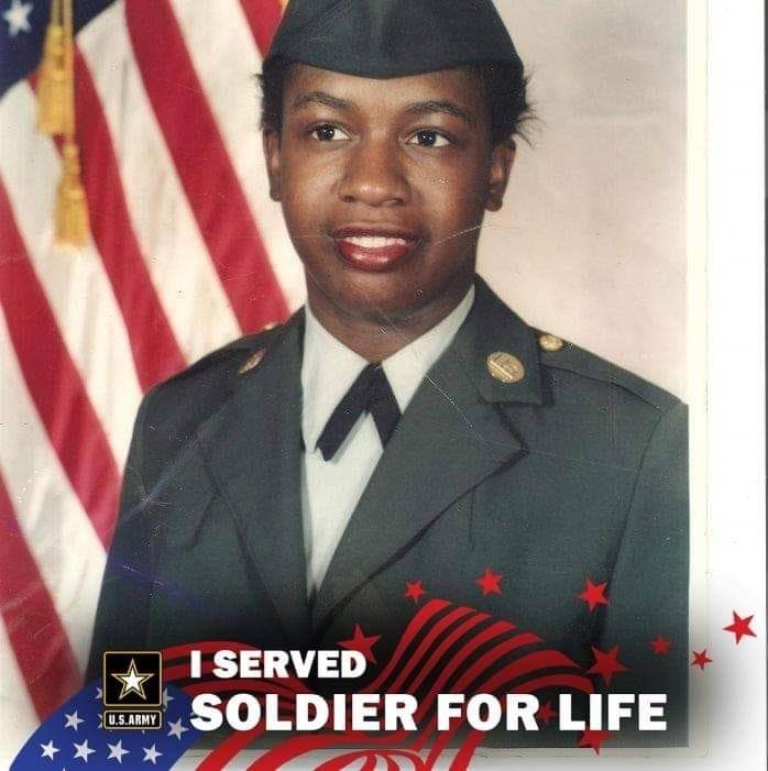 photo of utility employee during their days of service, dressed blue jacket and cap with US Army logo at bottom of photo and words I served, Soldier for Life in white font