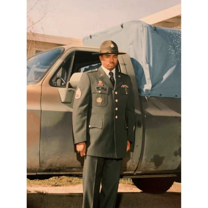 photo of utility employee in green uniform and hat from their days in service